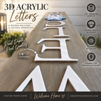 Angled view of raised white acrylic welcome lettering on a wood leaner