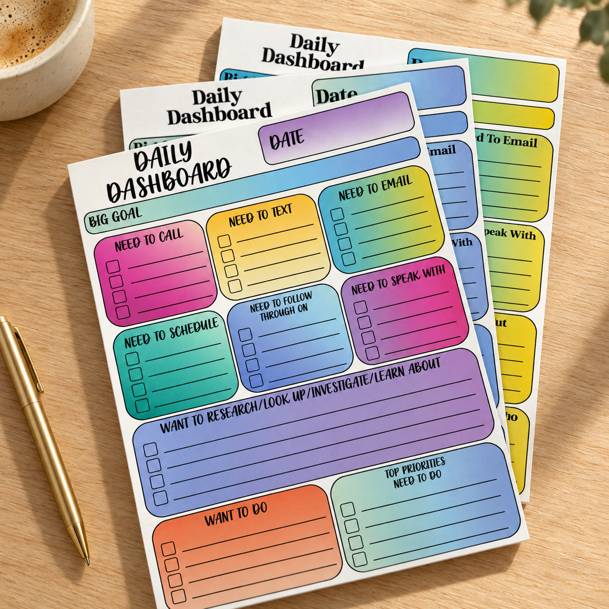 Three colorful Daily Dashboard planning pads in the Classic layout, arranged on a warm wood desk.