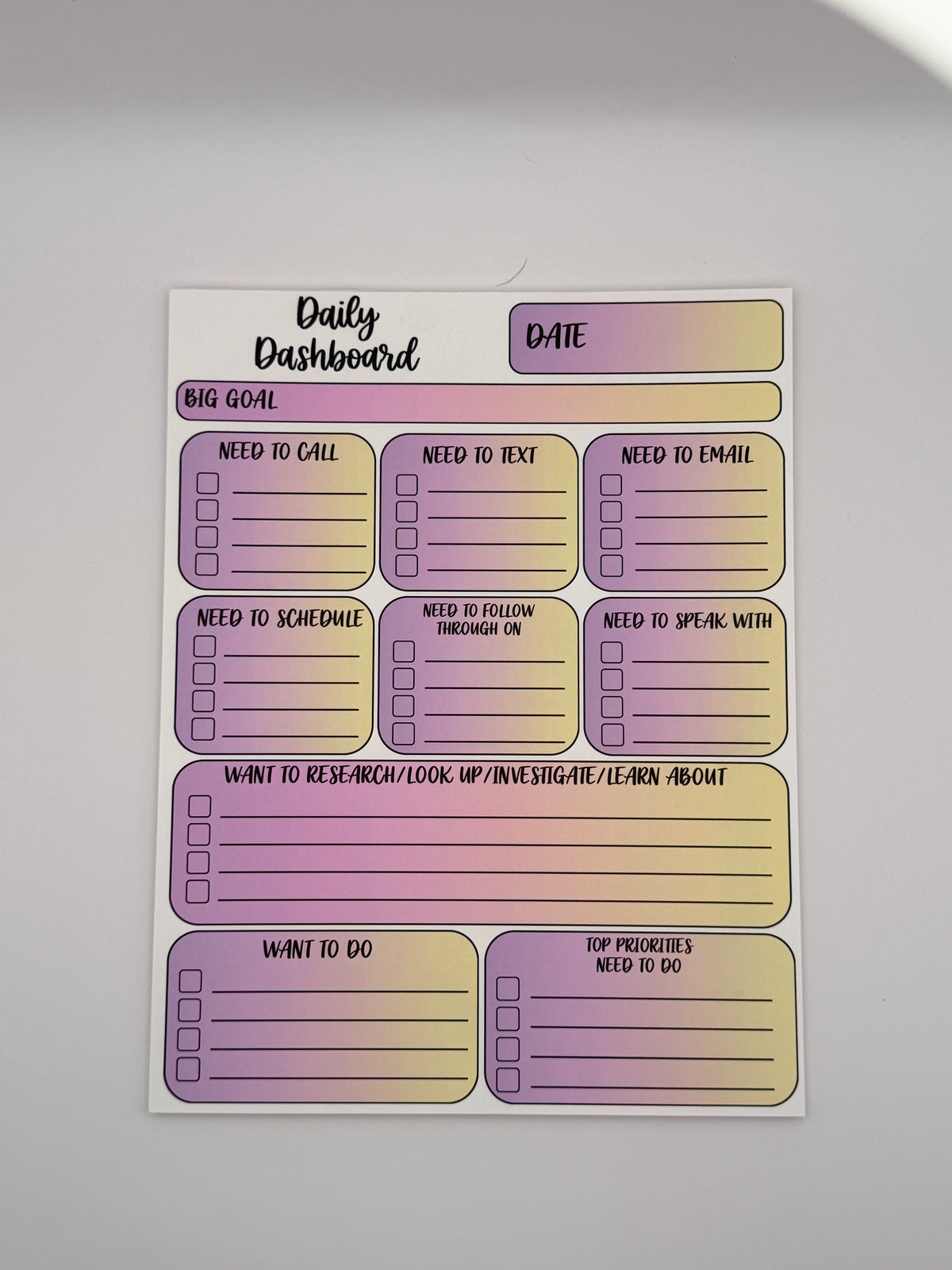Pink and Yellow Daily Dashboard planning pad in the Classic layout with handwritten-style lettering.