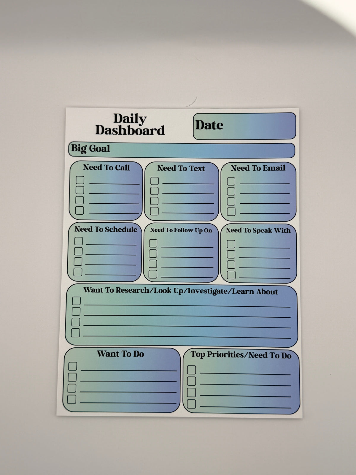 Mint and Blue Daily Dashboard planning pad in the Classic layout with bold serif lettering.
