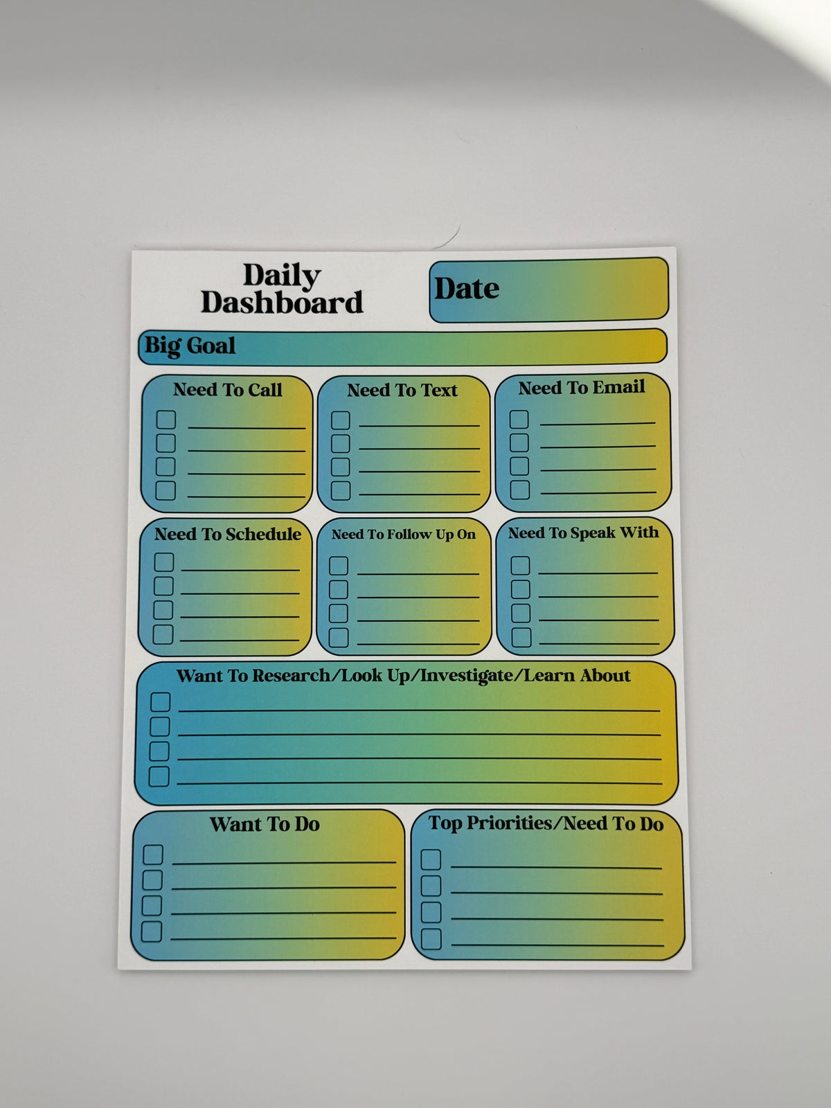 Teal and Yellow Daily Dashboard planning pad in the Classic layout with bold serif lettering.