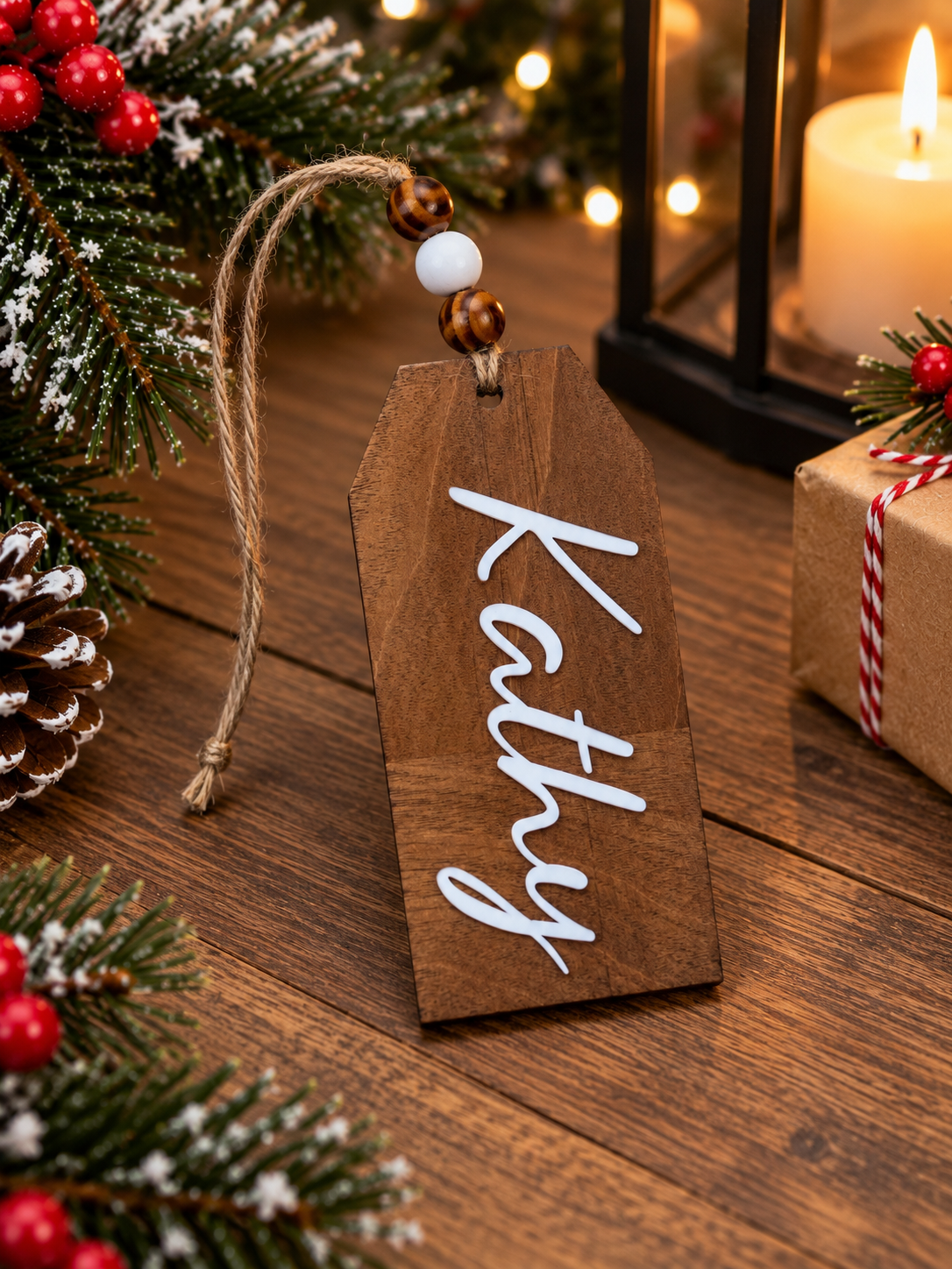 Walnut stained stocking name tag for Kathy hanging from jute twine with wood beads