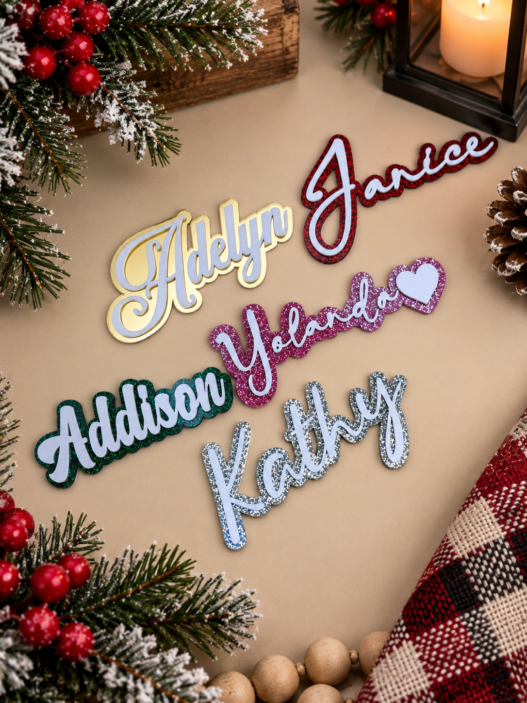 Acrylic name cutouts in glitter and solid colors used for layered stocking tags
